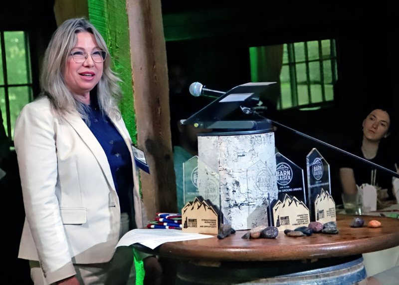 a woman standing doing a presentation