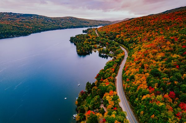 Scenic drive by a river on the left and beautiful fall foliage on the right